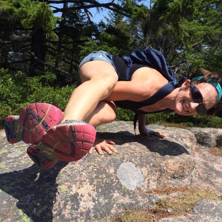 Bonnie Whitener doing a yoga pose on a rock