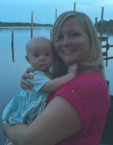 Sarah Sides with her baby niece by a lake